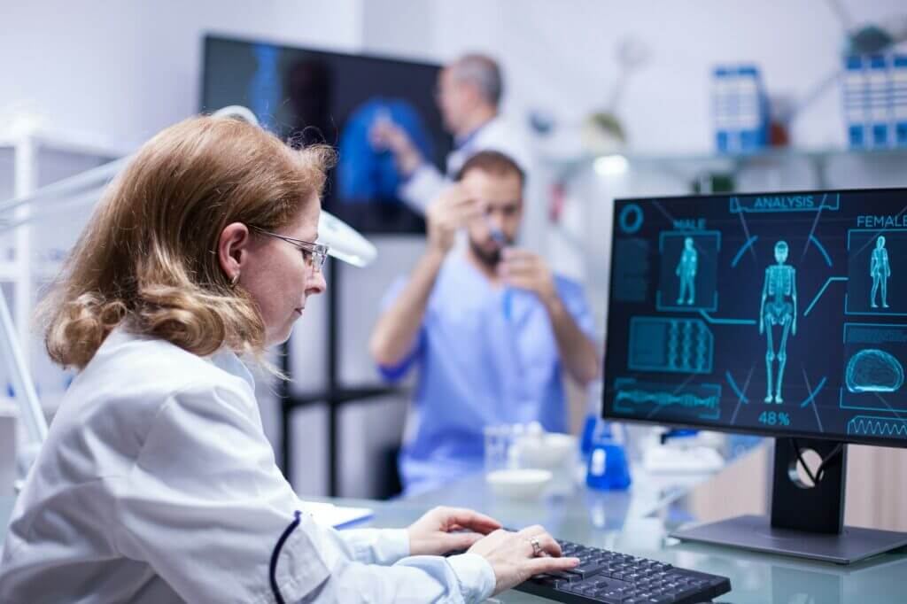 Woman working with computer in the office of a science laboratory