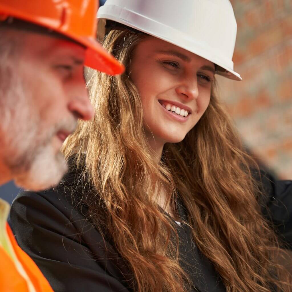 Ambitious young lady and mature architect working together